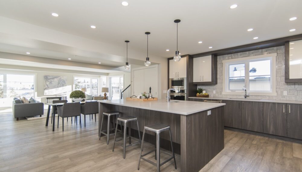 A beautiful shot of a modern house kitchen and dining room