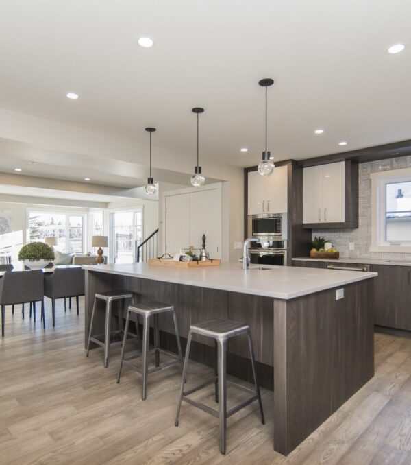 A beautiful shot of a modern house kitchen and dining room